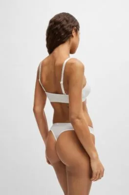 Tanga de tiro bajo en punto elástico con cinturilla logotipada